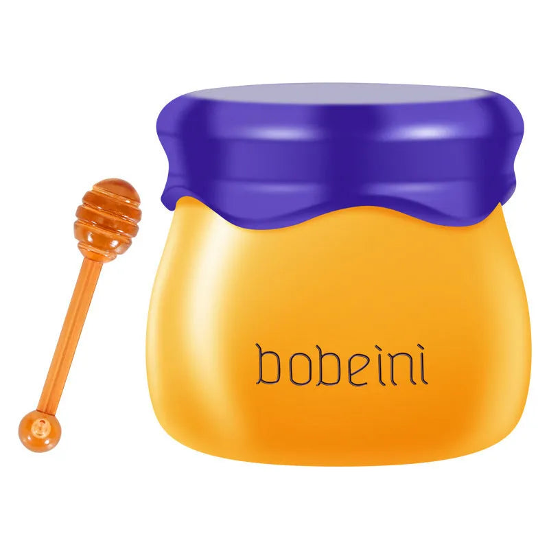 Vaseline lip balm in 9g honey pot with small brush applicator in pomegranate or blueberry flavour