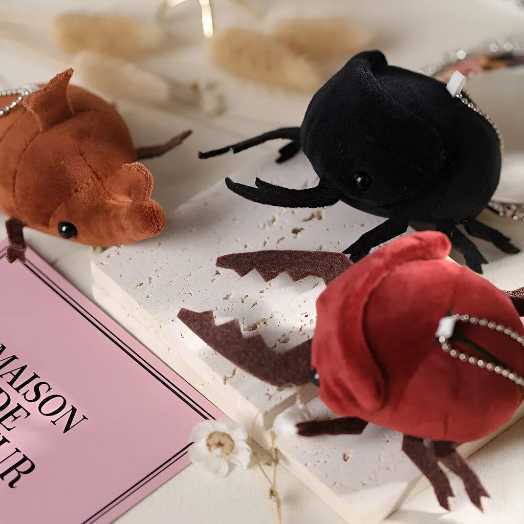 Small 10cm black plush doll of a Japanese rhinoceros beetle pendant with short pile fabric.