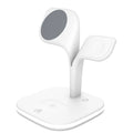 Black wireless charging station on desk with phone, watch, and headphones charging simultaneously