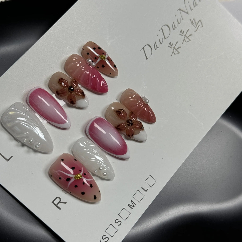 Hand-painted 3D carved nail art patches with embossed candy pattern on an Almond-shaped nail.