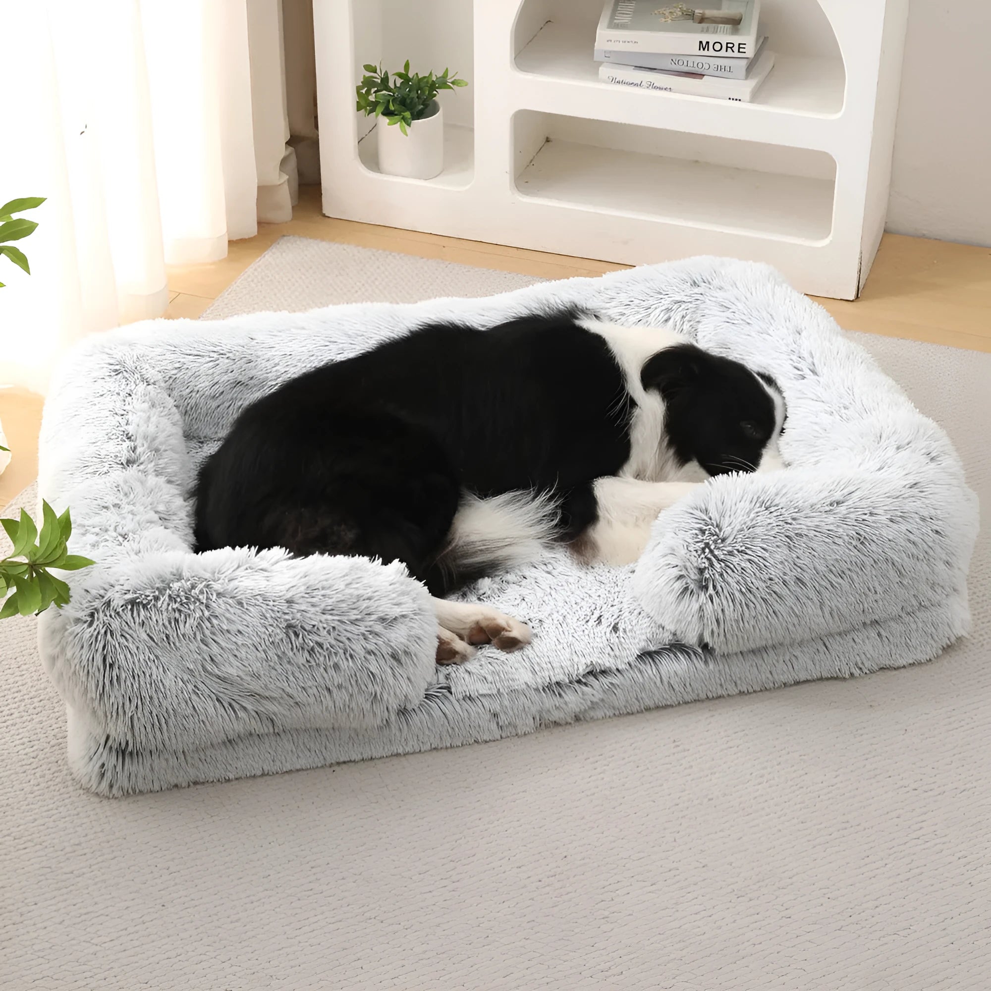 Plush round dog bed with raised edges in a solid colour, shown with a built-in inner sleeve.
