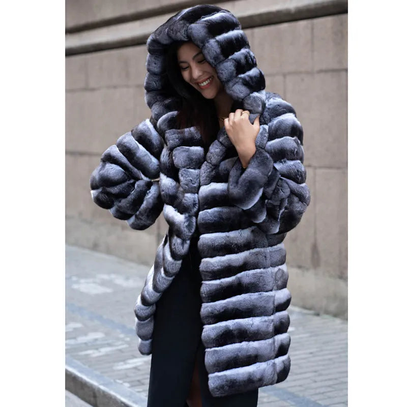 Women's zebra stripe pattern artificial mink faux fur mid-length coat on a hanger.