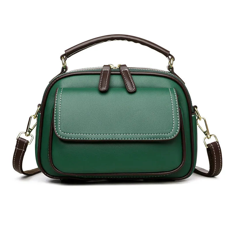 Women's black PU cross-body shoulder bag showing square shape and double connector straps