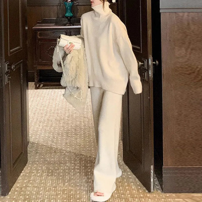 Women's milky white acrylic fibre sweater and wide-leg trousers two-piece casual set on a hanger.