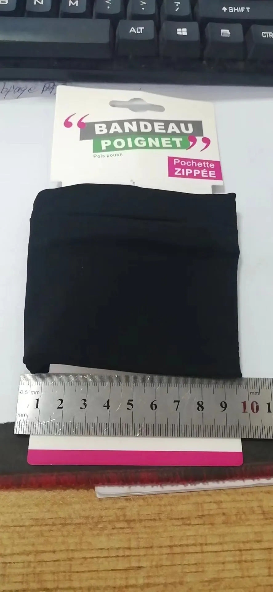 A compact wrist armband sleeve wallet for a mobile phone, shown with dimensions of 10 by 10.5 centimetres.