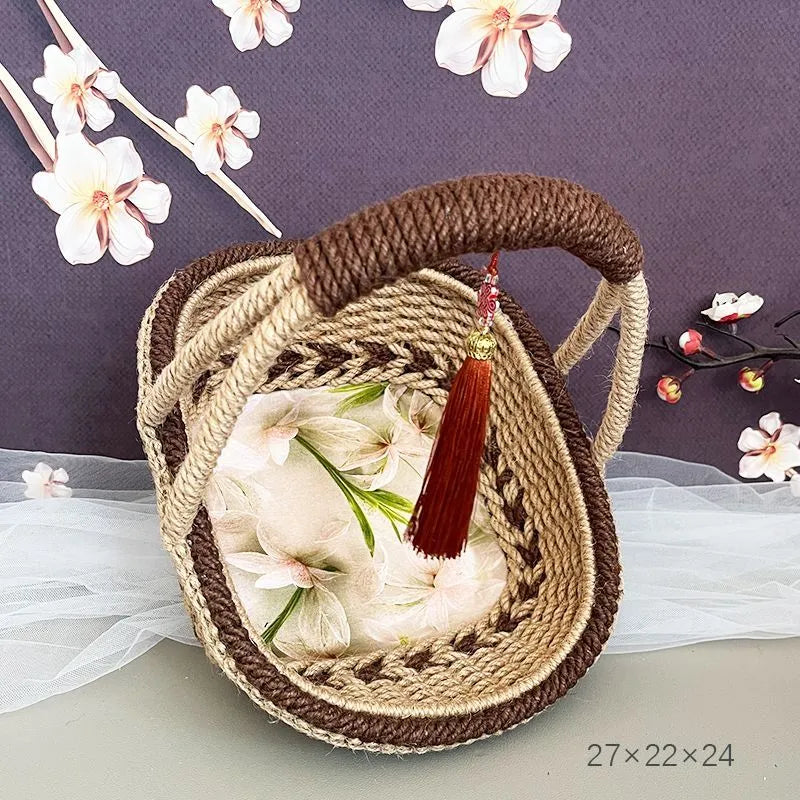 Hand-woven straw basket with hemp rope detailing in rustic coffee brown colour