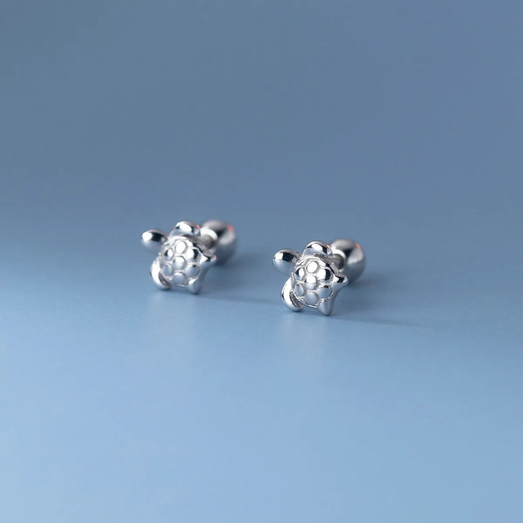 Small 925 sterling silver turtle stud earrings with thread line detail, shown in gold and silver colour options