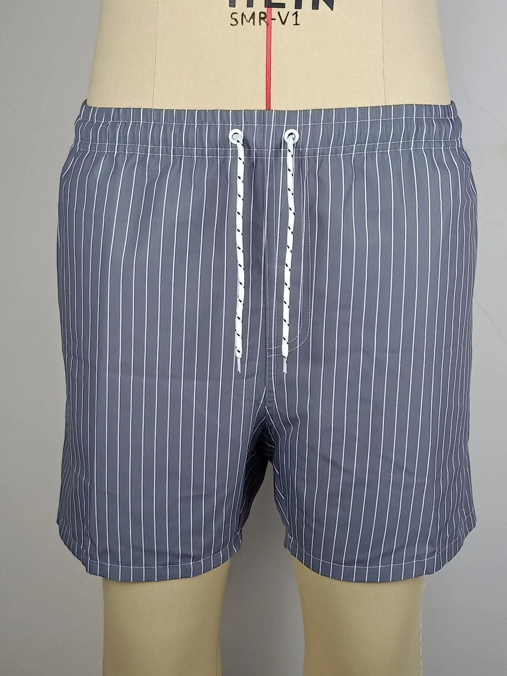 Men's striped beach shorts in light blue with a straight leg and triangle lining.