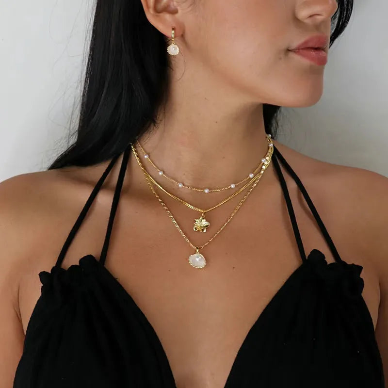 Gold copper pendant pearl necklace with ball bead chain on a geometric pendant