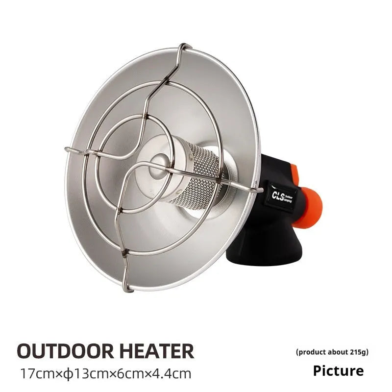 Black and orange portable outdoor camping heater stove with automatic ignition on a table.