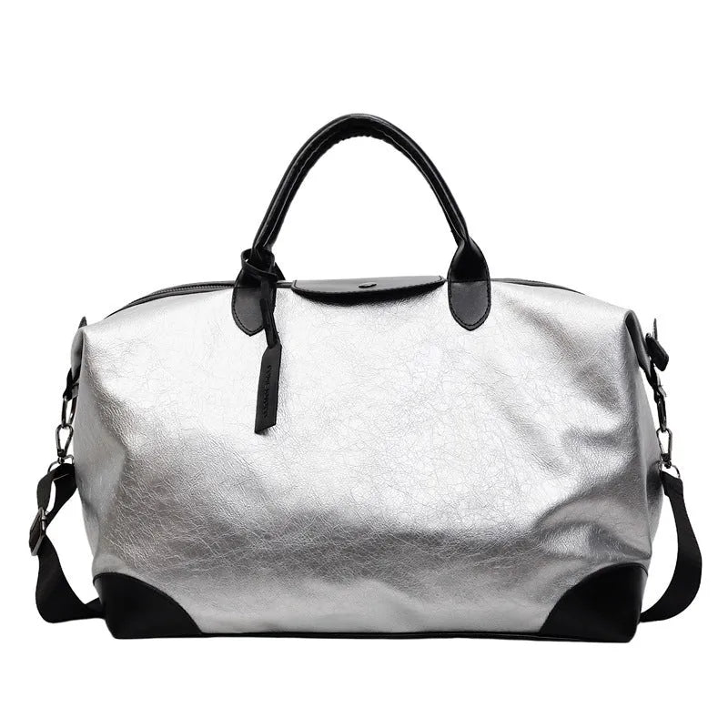 Women's hand-carrying travel bag in black or silver with 36-55L capacity