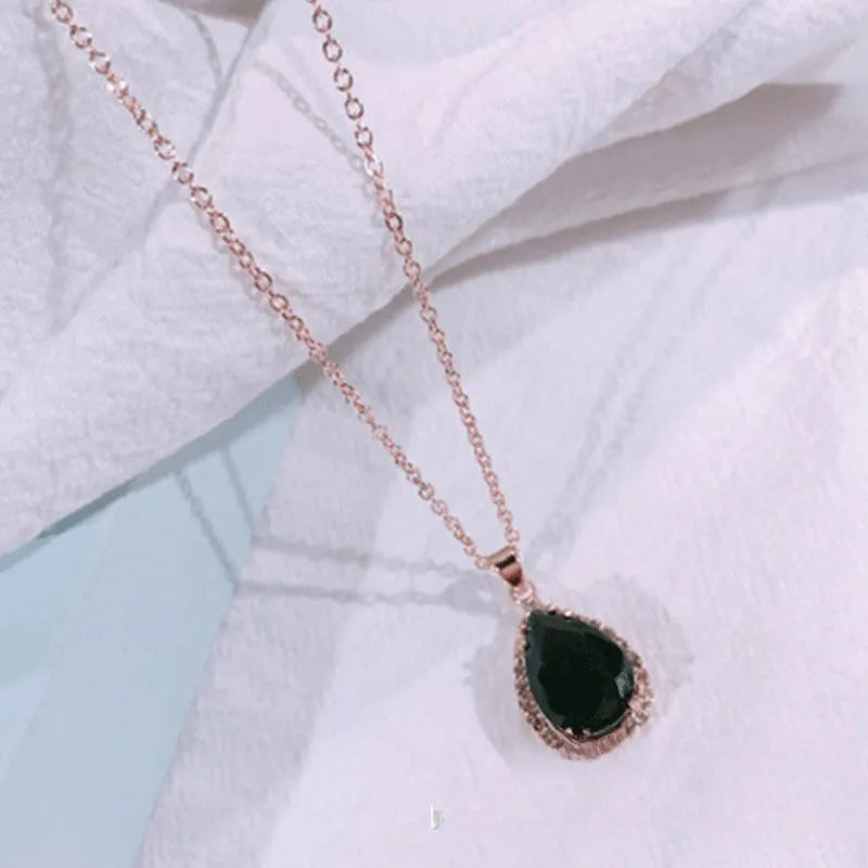 Geometric drop shape alloy necklace with rhinestone accents in rose gold pink finish