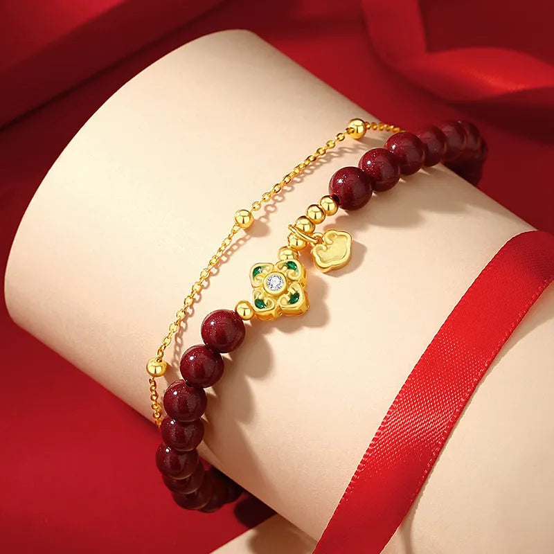 Sterling silver women's bracelet with Ruyi and Xiangyun motifs and cinnabar flower details