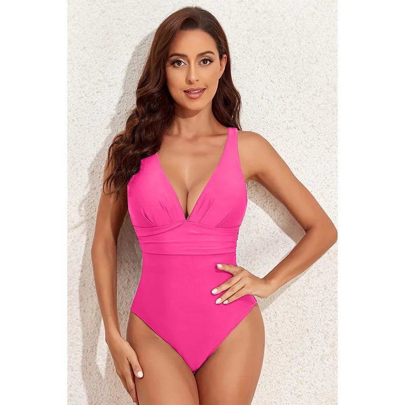 Women's solid colour cross-shoulder one-piece swimsuit on hanger