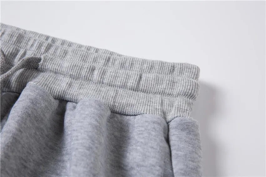 Letter printed men's casual sweater suit in black, showing top and trousers