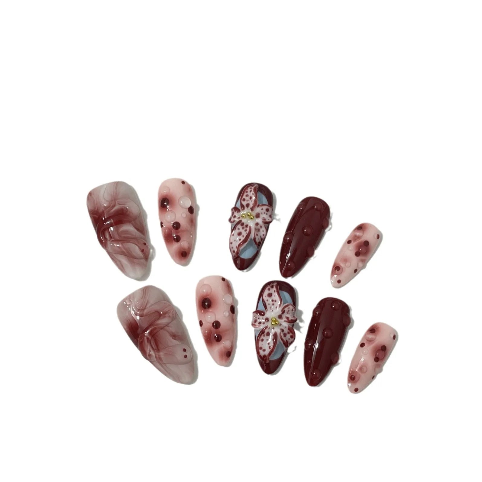 Set of almond-coloured artificial nails with hand-painted rose and 3D carved butterfly designs, showing short and medium lengths.