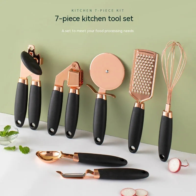 Seven-piece stainless steel kitchen tool set with copper handles on a cutlery rack, in rose gold colour.