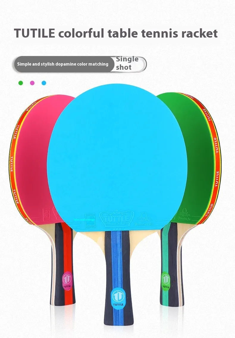 Blue, green, and pink professional table tennis rackets with long shakehand handles and matching carry bags.
