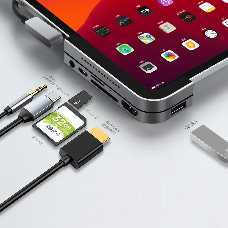 Silver aluminium grey Type-C 6-in-1 docking station for iPad Pro, showing multiple ports.