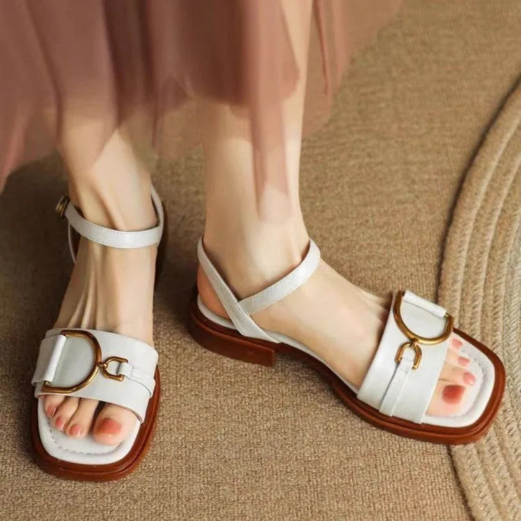 Women's thick-soled leather sandals in beige with button closure and round toe