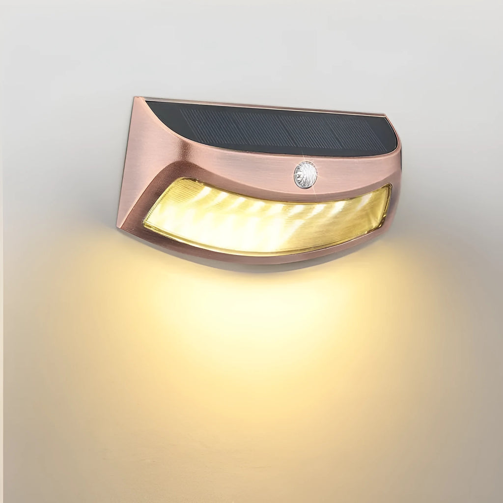 Solar outdoor wall lamp with decorative smiling face design for garden and courtyard lighting