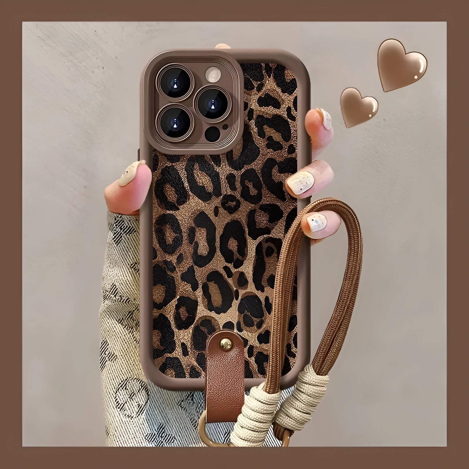 Brown leopard print silicone lanyard phone case for iPhone on a table