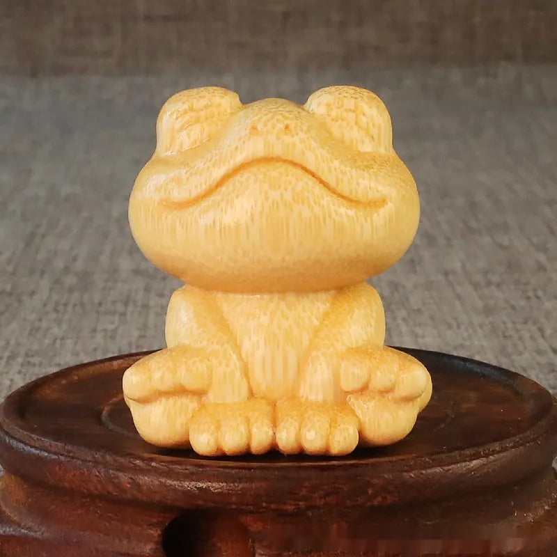 Solid bamboo smiling frog carving ornament with cartoon style measuring 5cm tall
