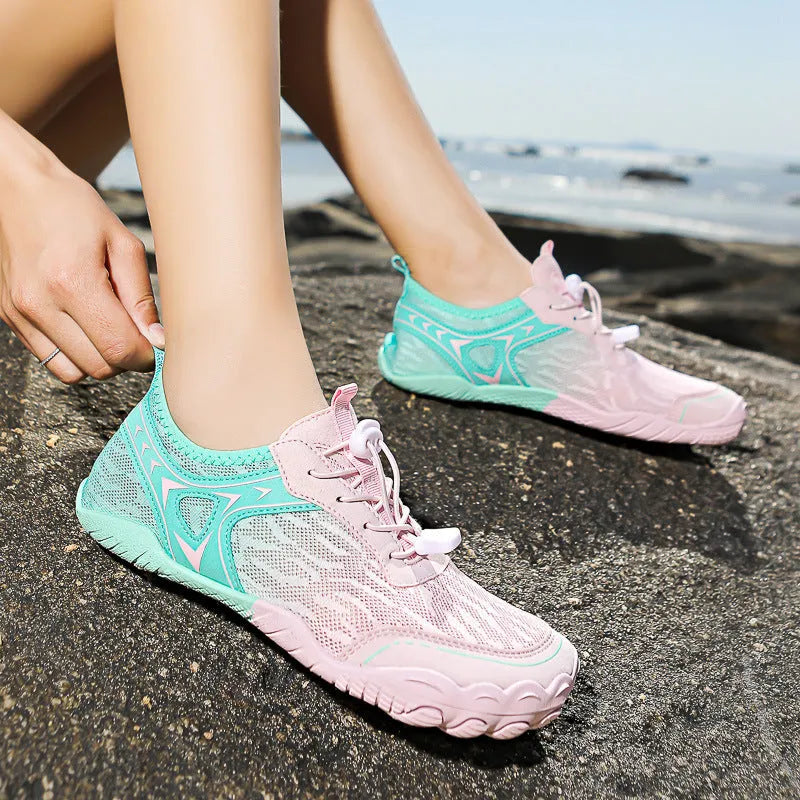 Five finger aqua shoes in army green colour with a low top design and elastic band.