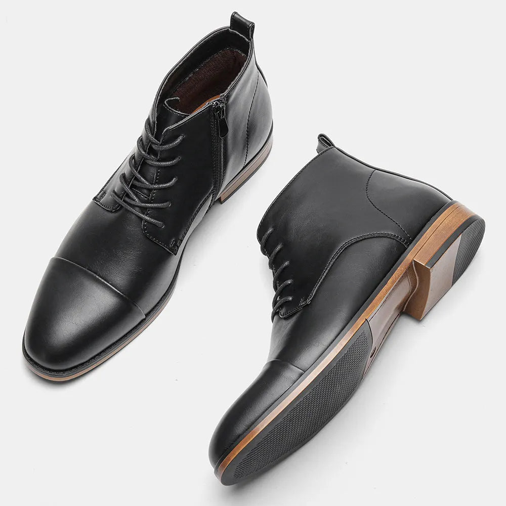 Men's brown Chelsea boot with side zipper, round toe, low heel, and wooden sole.