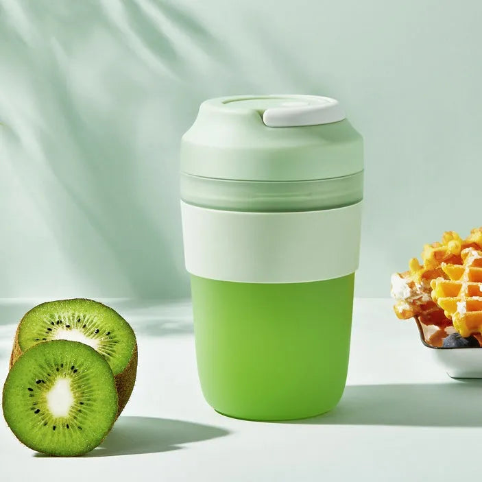 Grape purple portable USB blender cup with lid, showing stainless steel blades inside 400ml capacity bottle.