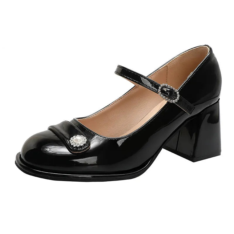 Apricot patent leather women's shoes with chunky heel, round toe, and buckle fastening.