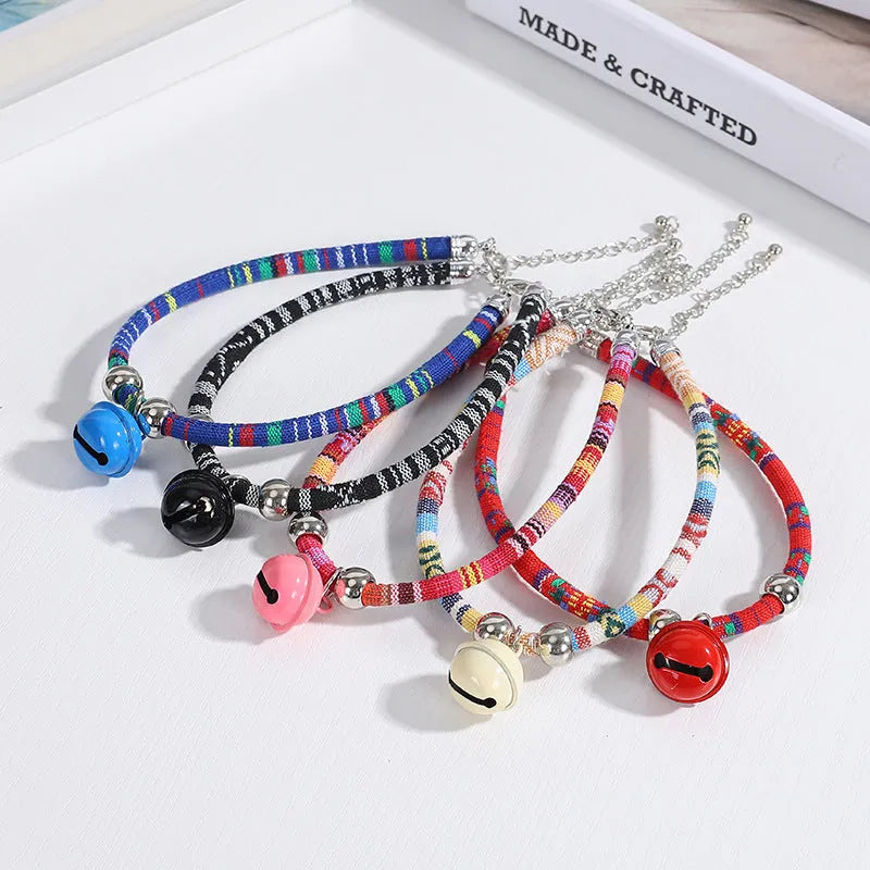 Ethnic style pet collar with bell in multiple colours showing adjustable fastening