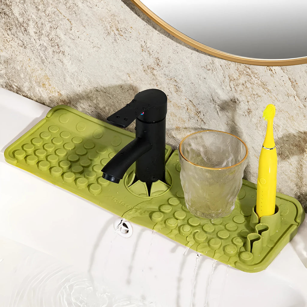 Cream TPR silicone faucet water draining pad measuring 42x14cm on a kitchen countertop