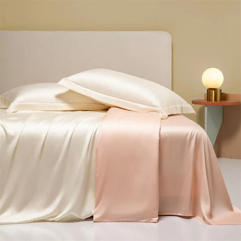 A modern Lenzing Tencel bedding set with a quilt cover and pillowcases in a neutral colour, laid flat on a bed.