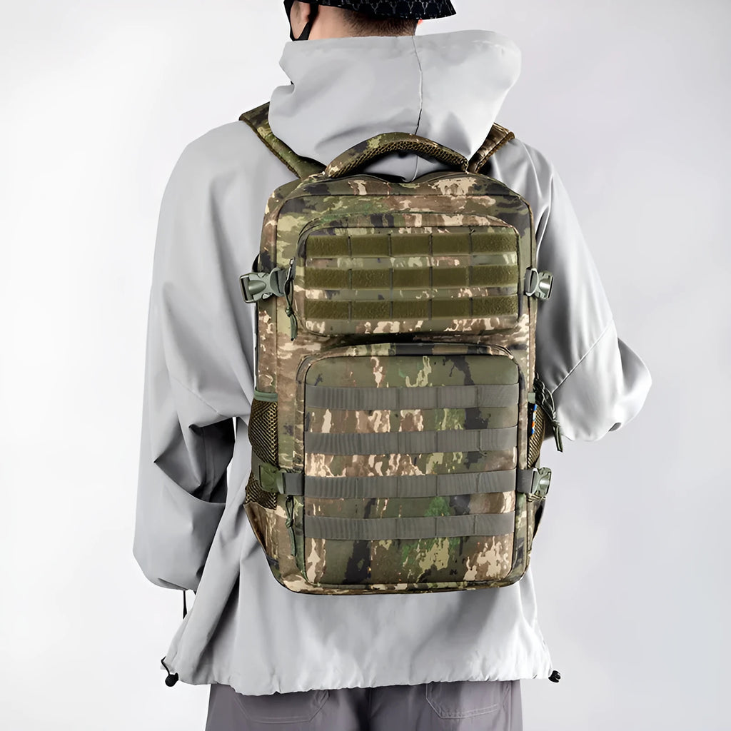 Outdoor mountaineering backpack in camouflage colour with curved shoulder straps and multiple compartments