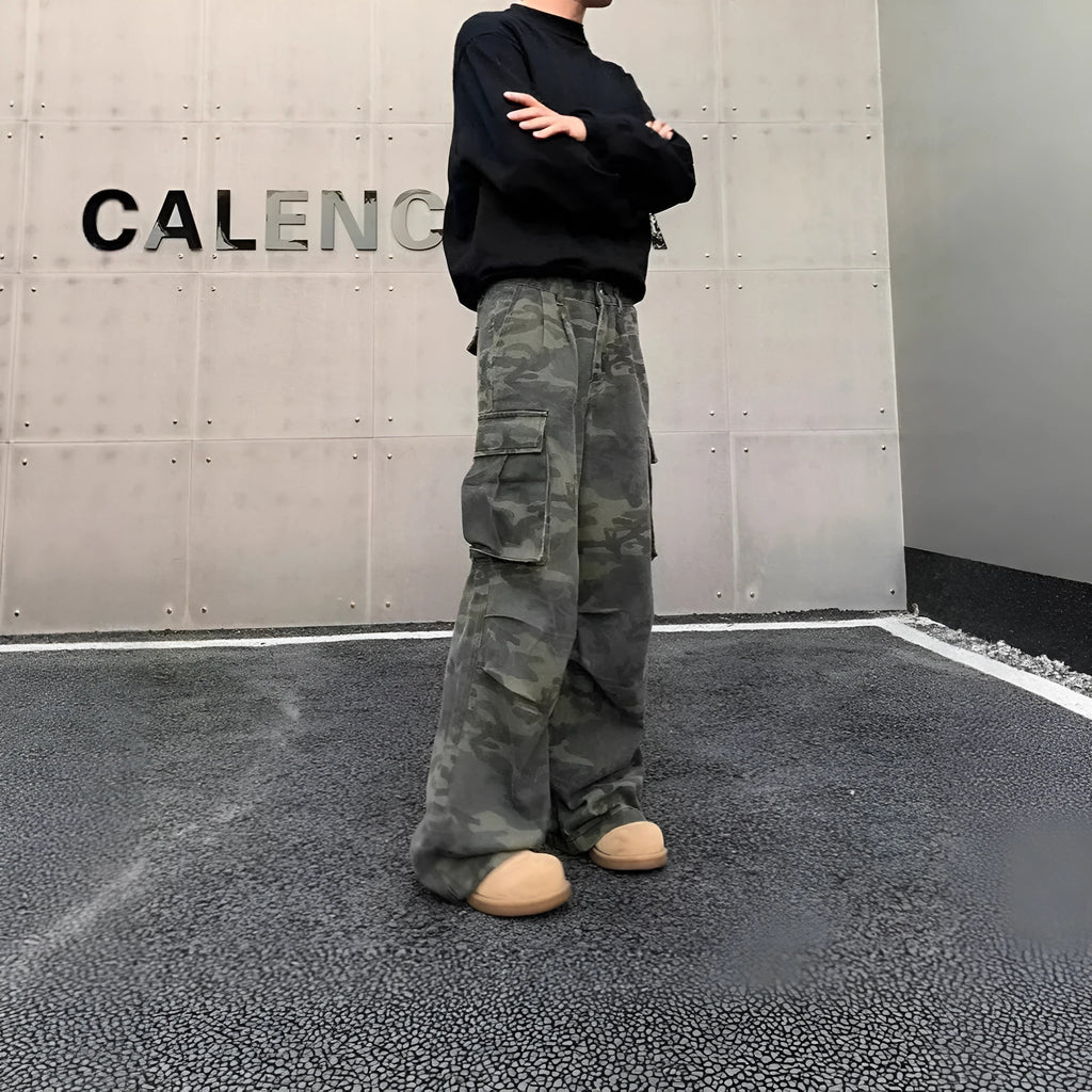 Cotton-blend cargo trousers in a washed camouflage pattern with multiple pockets, shown in colour K0915.