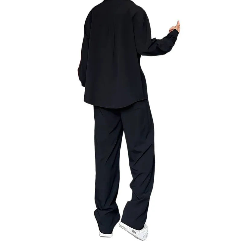 Men's black casual two-piece set with long sleeve polo shirt and matching trousers in slim fit design