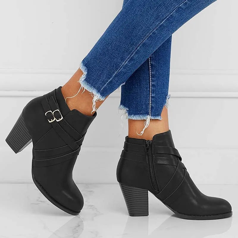Plus size women's short boots with a 7cm heel in black, featuring a side zip and buckle.