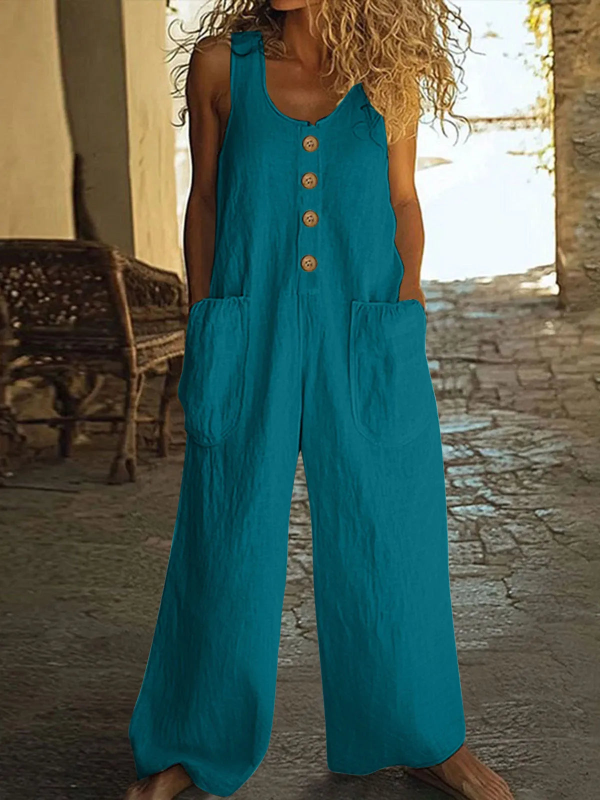 Sleeveless wide leg cotton jumpsuit in peacock green colour with pockets and loose fit.