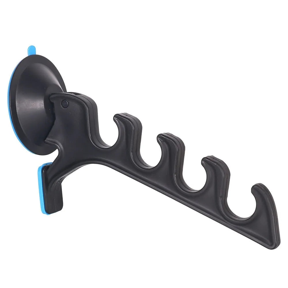 Black plastic car fishing rod bracket with suction cup mount for holding one fishing rod in a vehicle.