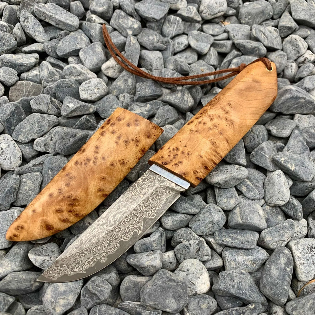 White Shadow Damascus pattern camping knife with Thuja wood handle, showing full 18cm length.