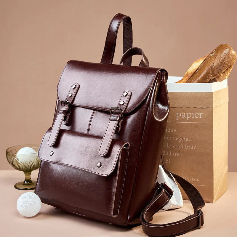 Women's leather computer backpack in black, brown, or coffee made from two-layer cowhide.