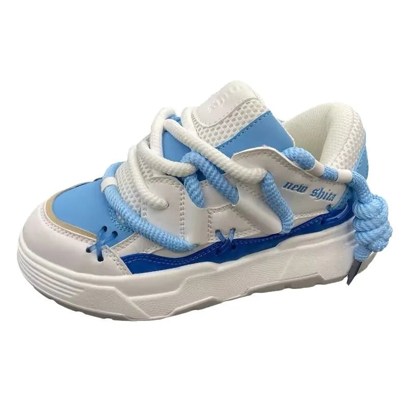 Grey retro clunky sneakers for women with thick sole for height increase and front lace-up closure.