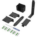 White adhesive wall hook holding a black game controller and a TV remote.