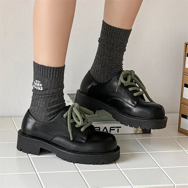 Men's derby style platform shoes with a microfiber upper and rubber sole.