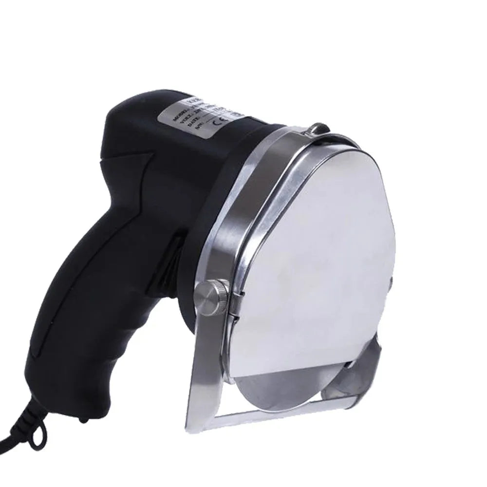 Black electric meat cleaver with power cord for turkey barbecue machines on a kitchen counter