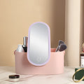 Pink gradient makeup storage box with LED mirror open showing storage compartments and USB charging port