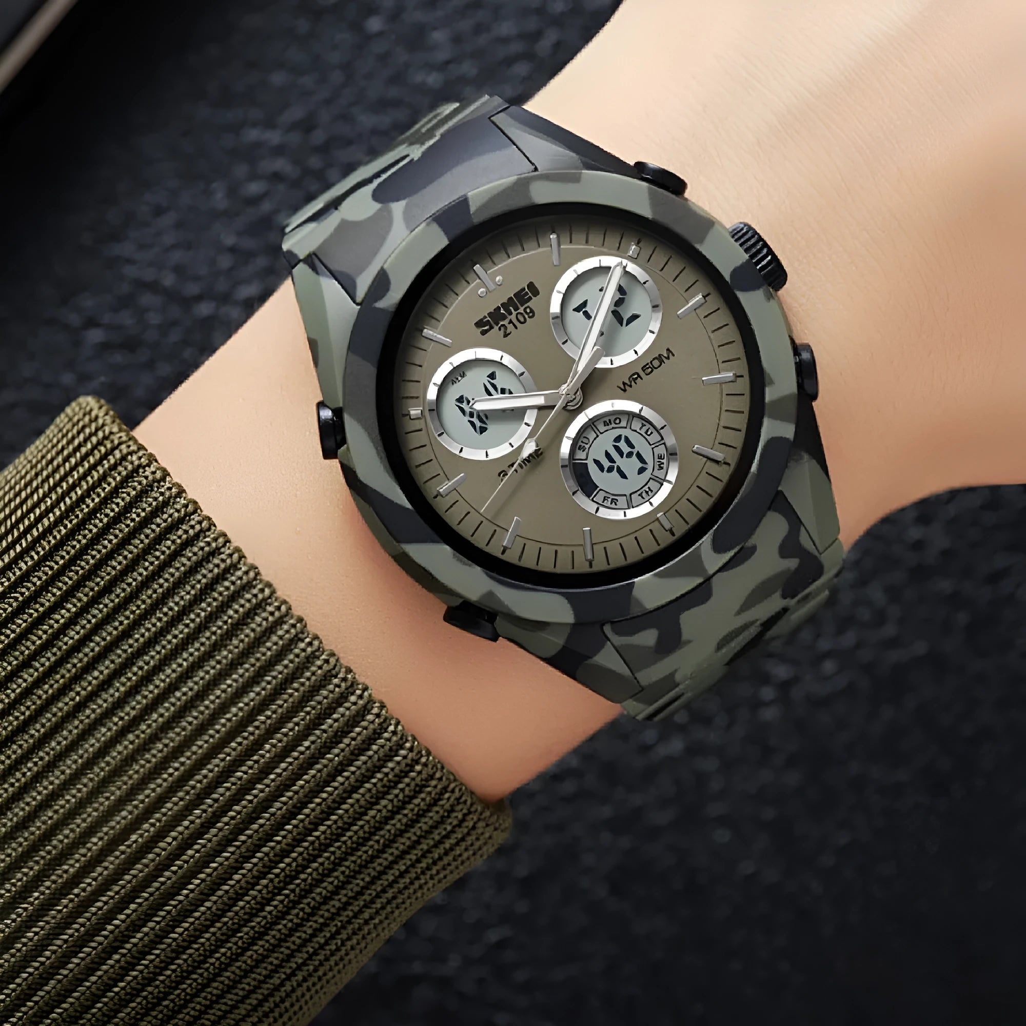 Electronic unisex casual watch with a camouflage-pattern strap showing water resistance and a stainless steel button.