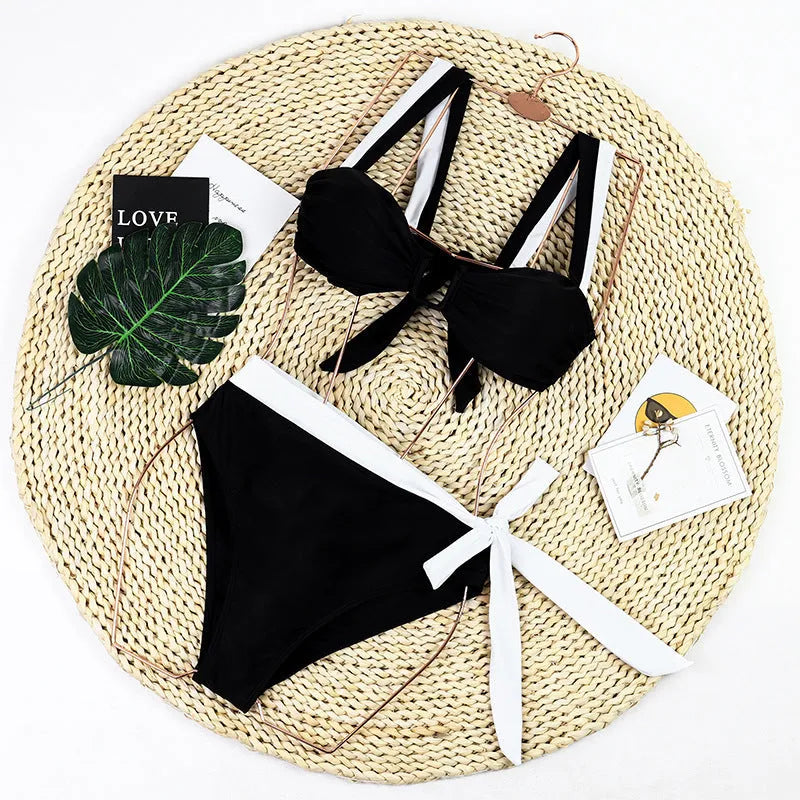 Black women's high-waisted bikini swimsuit set with two-piece top and bottoms.
