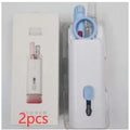 White multifunctional electronic cleaning kit with foldable pen, retractable brush, keycap puller, and spray bottle.